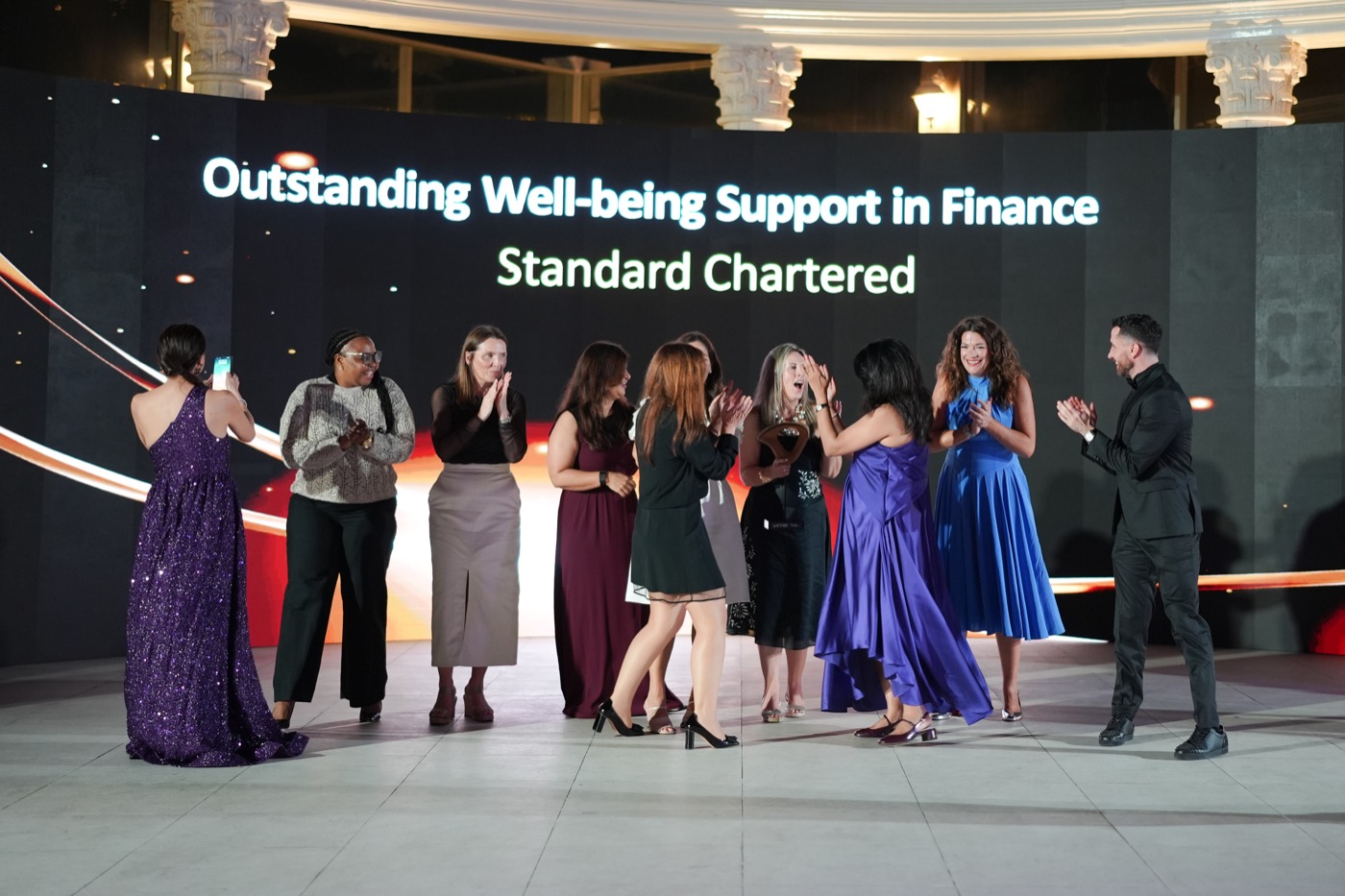 The Standard Chartered team celebrating at the mentl awards 2025